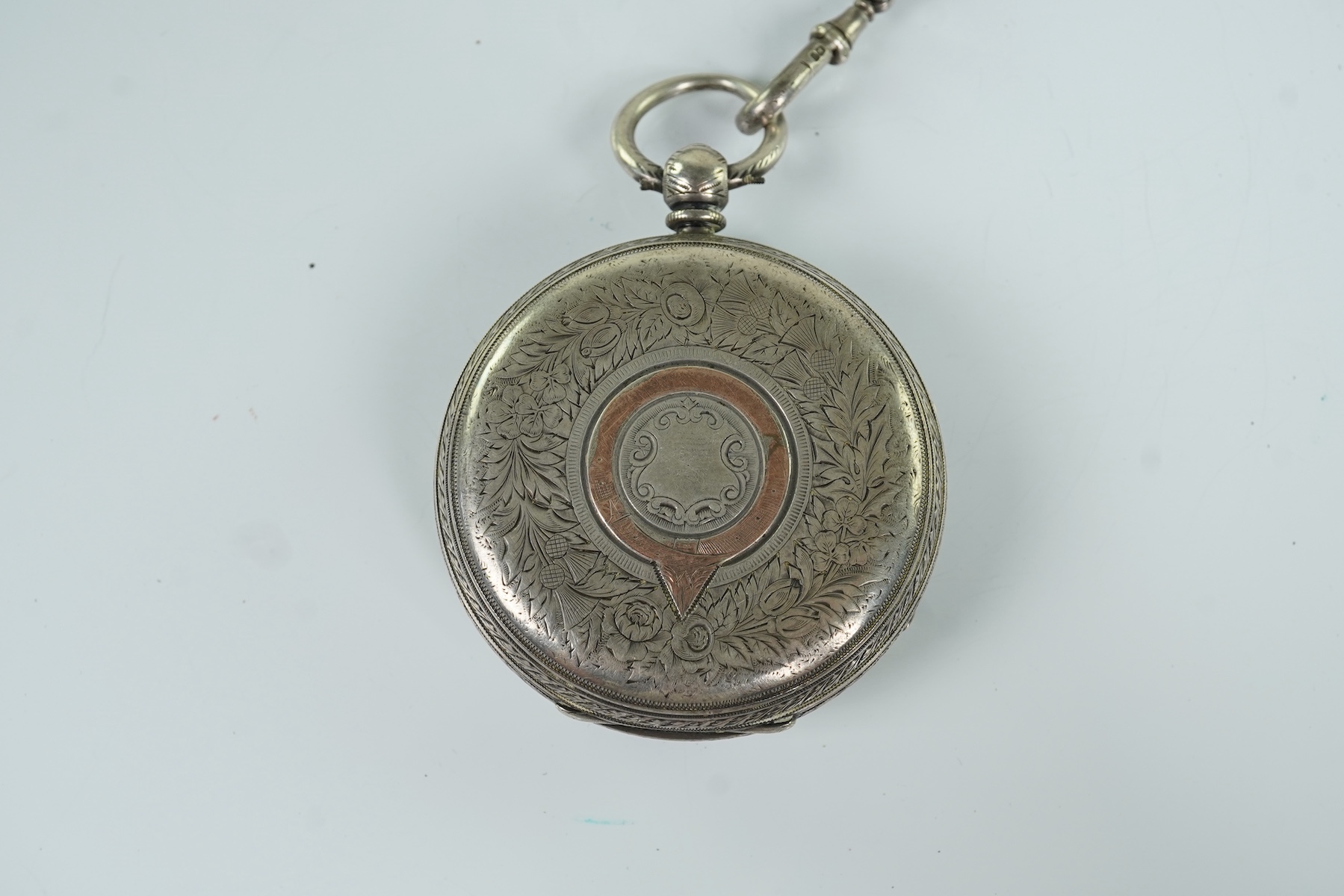 A late Victorian Horse Racing related engraved silver open faced keywind pocket watch, by J. Vickers, Leicester Road, Coventry, the enamelled dial with a signed painted bust of the jockey Fred Archer to the centre and fl